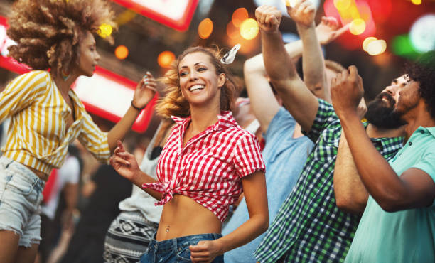 istock Friends dancing at a concert. 1151031335