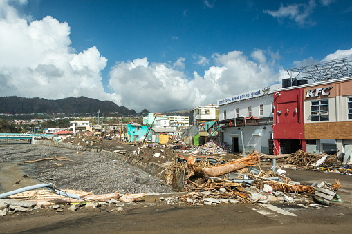 one of typical scenes to be seen in Dominica after this 2017 mega-hurricane with wind gusts at 440 km/h. It also dropped over 6 ft of water over just 8 hours. winds and floods destroyed Roseau and the island. Here we see wide destruction of capital town Roseau inflicted by winds and flooding of usually small Roseau river.