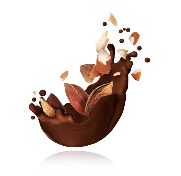 istock Splash of melted chocolate with crushed almonds closeup on white background 1151040900