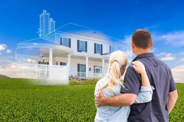Photo of Couple Facing Ghosted House Drawing and Photo Over Green Landscape