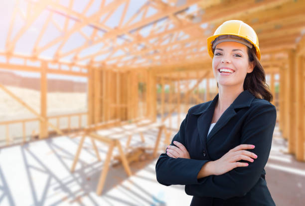 istock Smiling Female Contractor In Hard Hat At Construction Site 1151041994