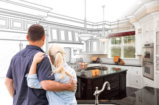 Couple Facing Custom Kitchen Drawing Gradating To Photo Couple Facing Custom Kitchen Drawing Gradating To Photo. renovation stock pictures, royalty-free photos & images
