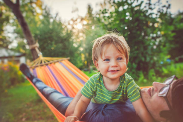 istock Family enjoying spring/summer day in hammock 1151043094