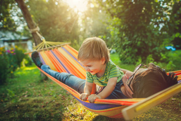 istock Family enjoying spring/summer day in hammock 1151043098