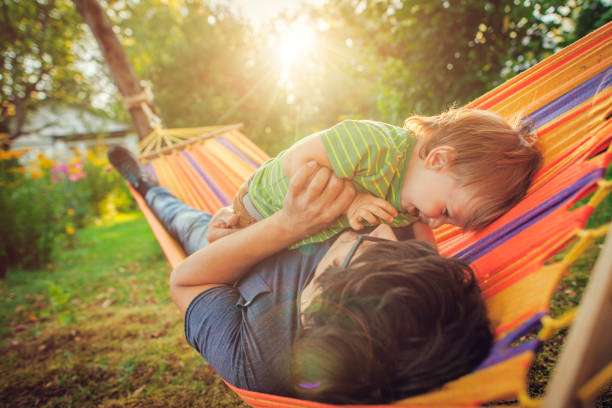 istock Family enjoying spring/summer day in hammock 1151043115