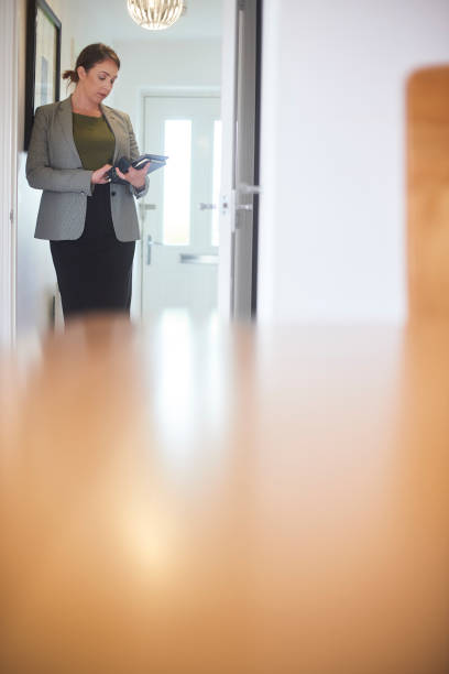 istock Esate agent taking details of house 1151044828