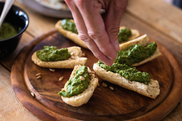 istock Tosted bread slices with spinach pesto ad sunflower seed 1151047608
