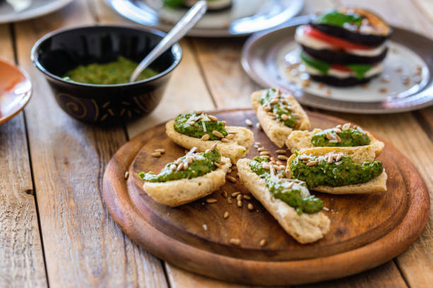 istock Toasted bread with spinach pesto and eggplant burger 1151047669