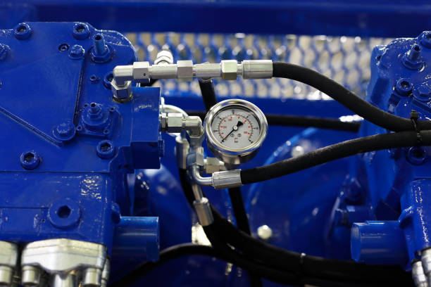 closeup view of air compressor with pressure gauge Close up view of air compressor with pressure gauge. Selective focus. compressor photos stock pictures, royalty-free photos & images