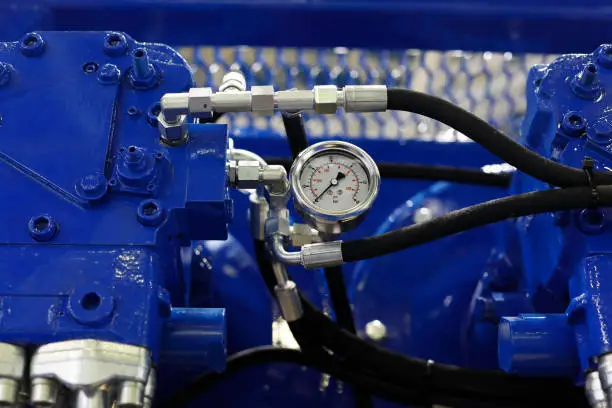 Photo of closeup view of air compressor with pressure gauge