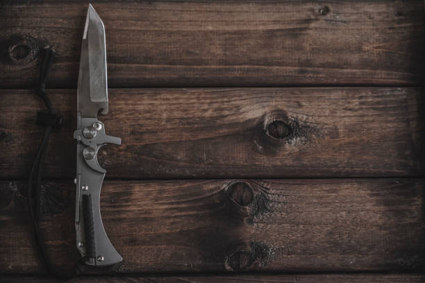 istock knife on wooden background 1151049590