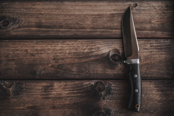 istock knife on wooden background 1151049600