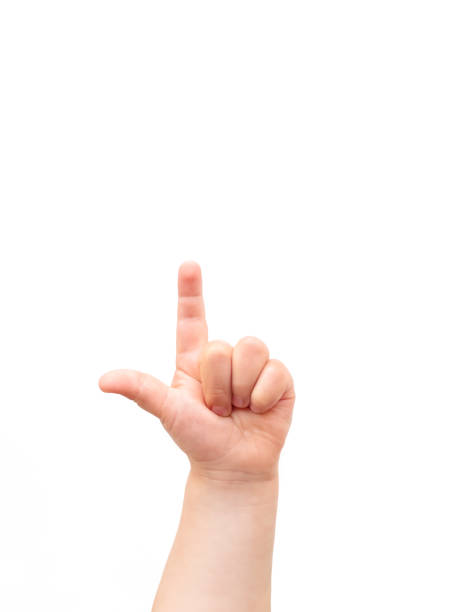 istock Child's hand on white background. The child points at something with his index finger. Flat lay, top view, copyspace. 1151049760