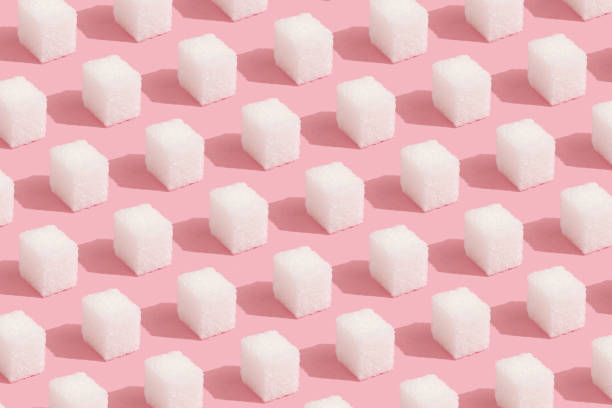 istock Abstract Pattern made of sugar cubes on pink Minimal style background 1151049929