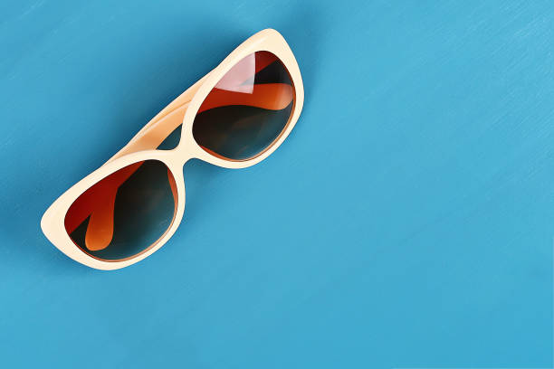 istock Sunglasses on a blue background. Top view. Summer background. 1151051807