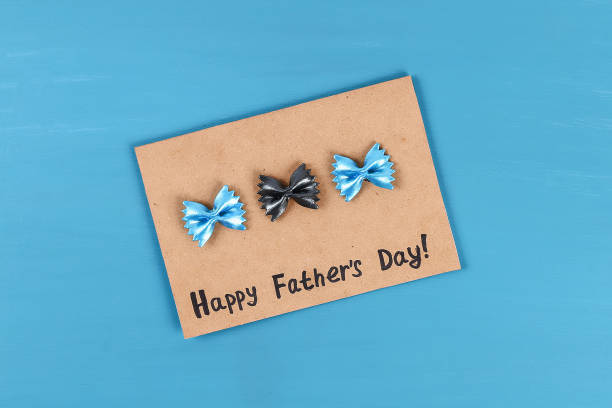 istock Diy greeting card father day pasta form bow tie blue background. Gift idea, decor Father day, Daddy. 1151051839