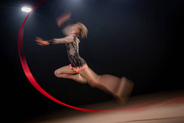 istock Blurred motion of a gymnast in mid air 1151051972