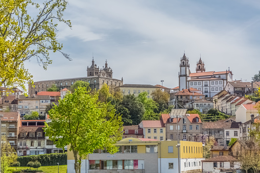 Viseu / Portugal - 04 16 2019 : View at the Viseu city, with Cathedral of Viseu and Church of Mercy on top, Sé Catedral de Viseu e Igreja da Misericordia, monuments of various classical styles, architectural icons of the city of Viseu, Portugal