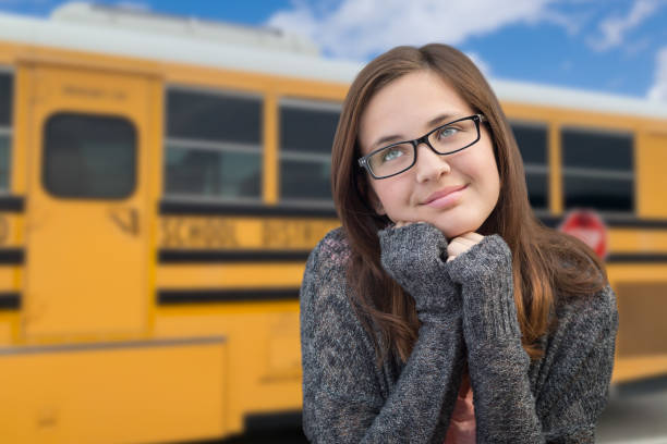 istock Young Female Student Near School Bus 1151053961