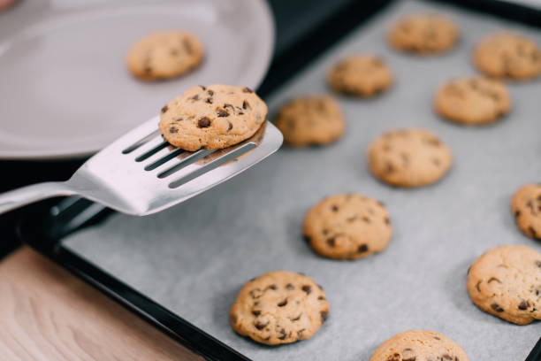 istock Freshly baked cookies on spatula, close-up 1151054255
