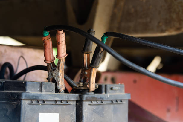 istock Charging truck batteries using jumper cables jump start engine booster cables 1151055334