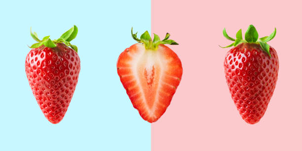 istock Different strawberries on bright background. Minimal food concept. 1151055562