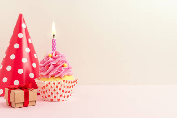 istock Colorful celebration background with various party decoration and cupcake. Minimal party concept. 1151055573