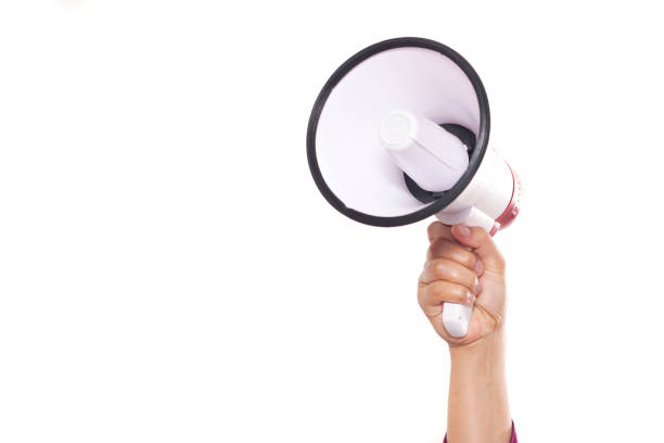 Hand Holding Megaphone Isolated on White Background Hand holding megaphone isolated on white background with copy space for your text, Marketing promotion announcement concept beckoning photos stock pictures, royalty-free photos & images