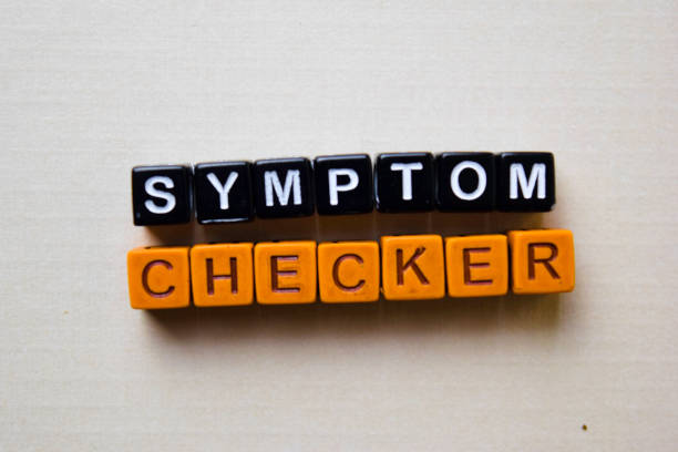 Symptom Checker on wooden blocks. Business and inspiration concept stock photo
