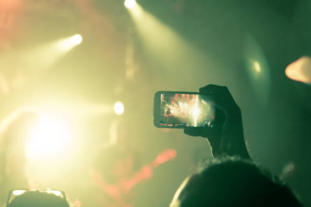 istock Filming concert on smart phone 1151066462