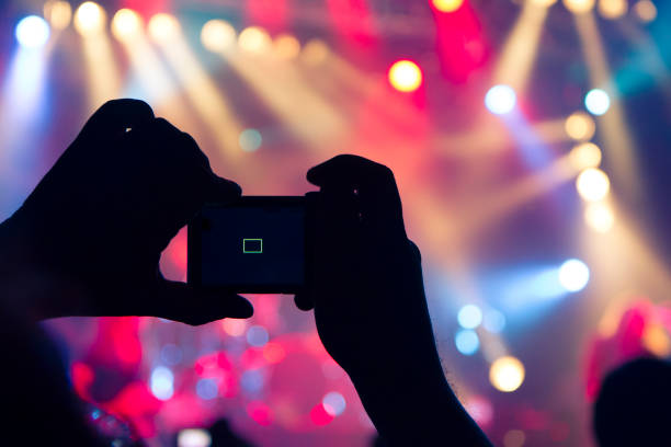 istock Filming concert on smart phone 1151066465