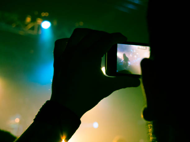 istock Filming concert on smart phone 1151066477