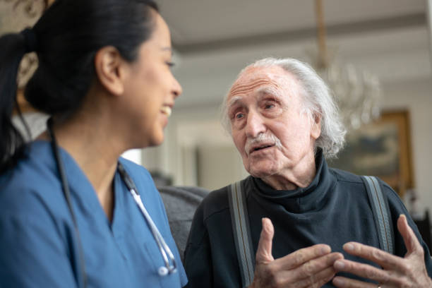 istock Elderly Gentleman With Nurse During Home Care Visit 1151067492