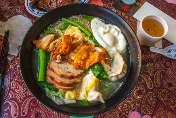 istock Red pork noodles, fried chicken, dumplings, fried eggs, vegetables and soups. 1151067562