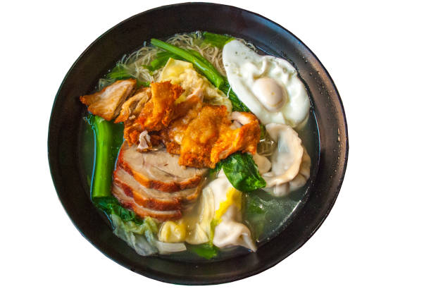istock Red pork noodles, fried chicken, dumplings, fried eggs, vegetables and soups. 1151067563