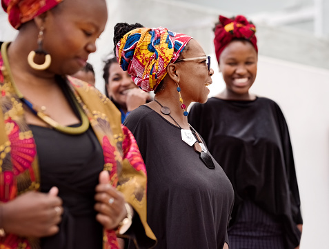 Group of african women wearing traditional african print in a modern way walking outdoors