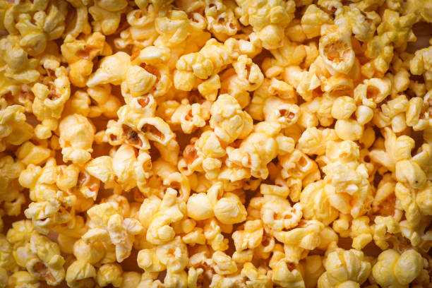 istock Close up popcorn - Sweet butter popcorn texture background top view 1151077333
