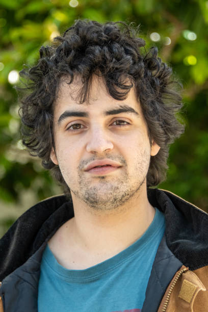 istock Smiling young hispanic man looking at the camera 1151082411