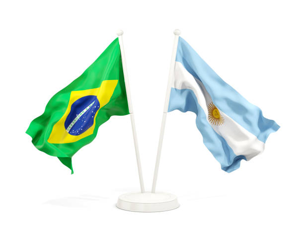Two waving flags of Brazil and argentina isolated on white stock photo