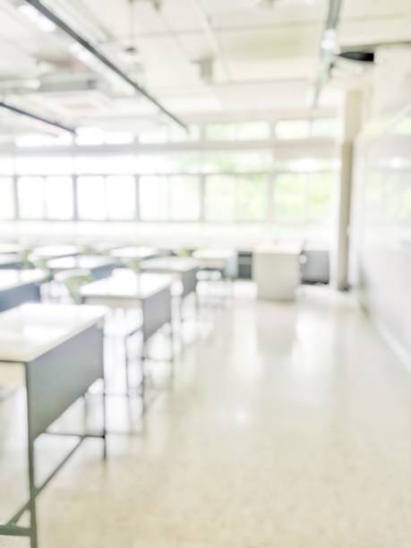 istock School classroom in blur background without young student; Blurry view of elementary class room no kid or teacher with chairs and tables in campus. 1151088988