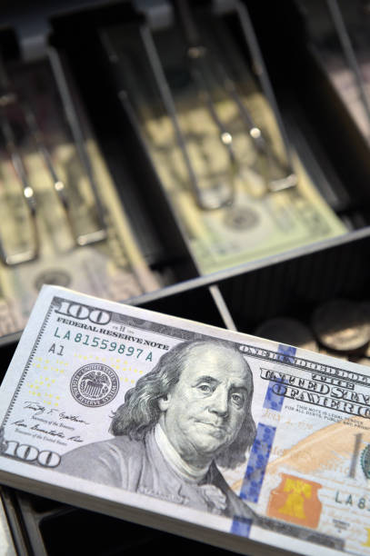 istock High angle view of cashier searching 1151094011