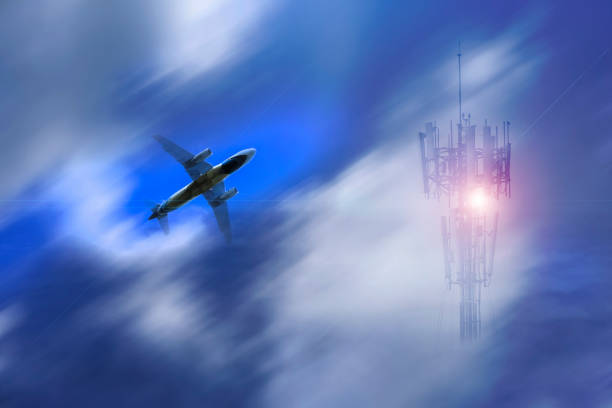 transportation business concept : airplane flying fast behind the clouds stock photo