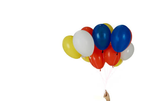 istock Group colorful balloons and hand on isolated white background. 1151099978