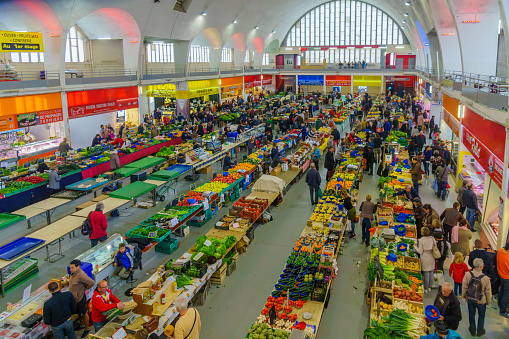 Villefranche-sur-Saone, France - May 04, 2019: French market scene with sellers and shoppers in Villefranche-sur-Saone, Beaujolais, Rhone department, France