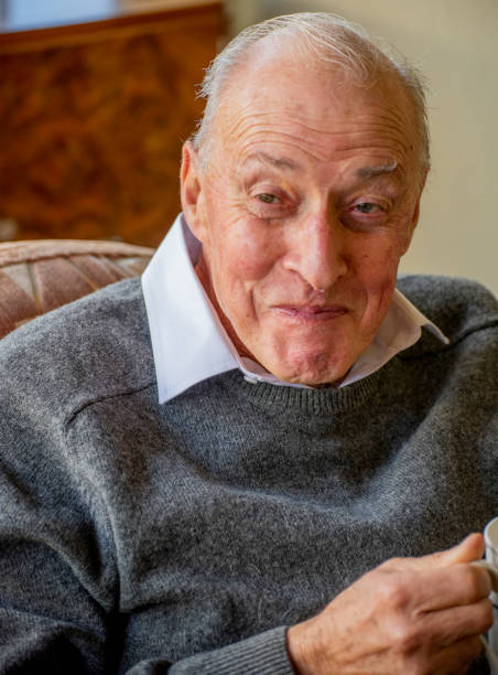 istock older man enjoys a mug of tea on a winters afternoon. 1151101931