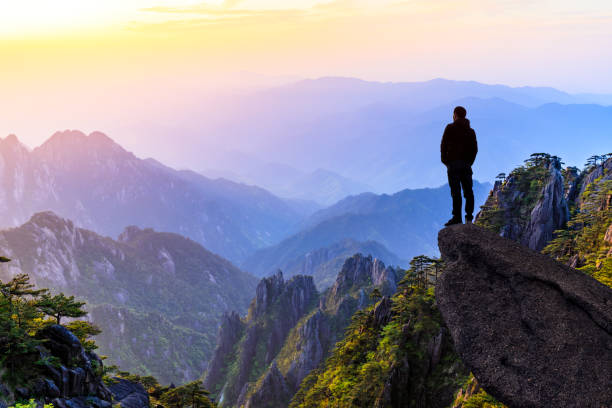 istock Man on top of mountain,conceptual scene 1151102031