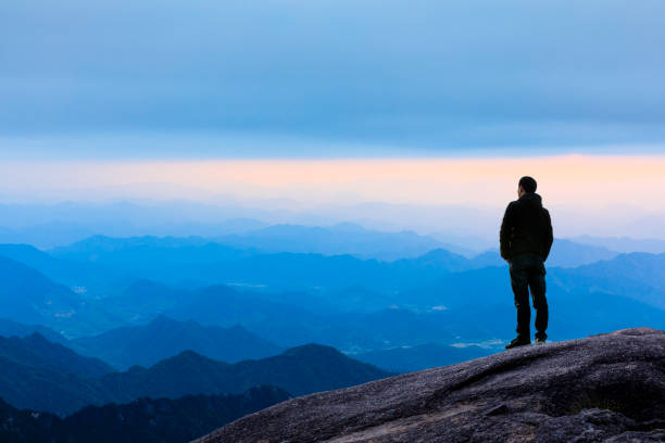 Man on top of mountain,travel concept scene