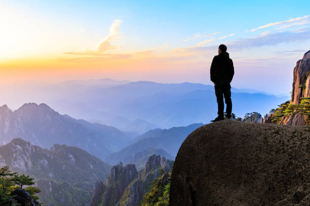 istock Man on top of mountain,conceptual scene 1151102051