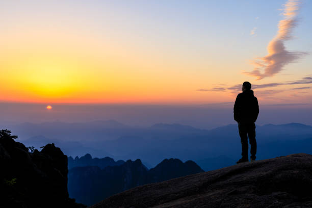 istock Man on top of mountain,conceptual scene 1151102052