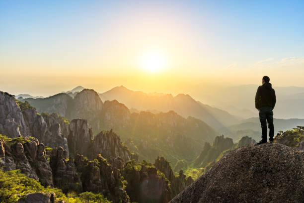 istock Man on top of mountain,conceptual scene 1151102065